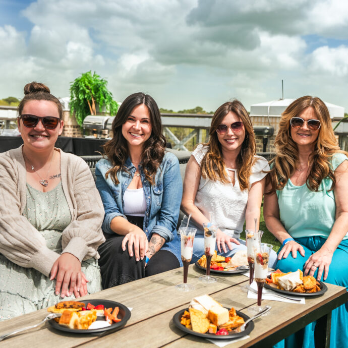 Group of women enjoying brunch at AVA Rooftop Bar.