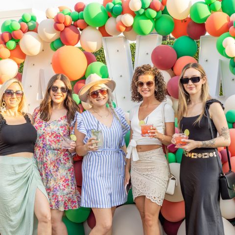 Ladies Standing in Front of AVA Photo Display